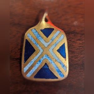 Hand crafted artisan made hand painted gold and blue pendant.